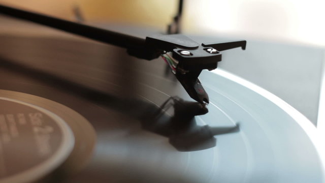 Vinyl rotating on a turntable, close up
