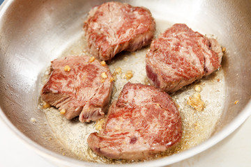 beef steak in a frying pan