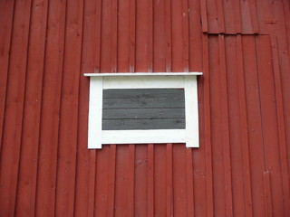Fototapeta na wymiar white frame on red wooden wall