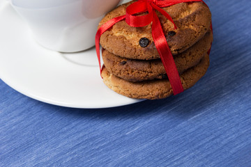 cookies with chocolate pieces and cup