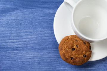 cookies with chocolate pieces and cup