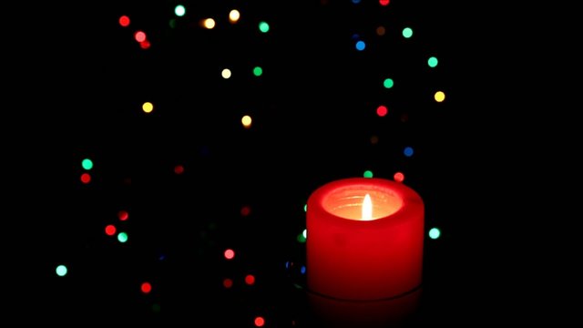 Christmas candle on the background the Christmas tree