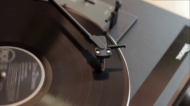 Record player with vinyl record, out of focus