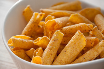 cheese potato chips in a white bowl