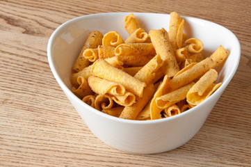 cheese potato chips in a white bowl