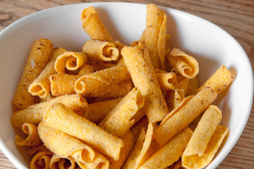 cheese potato chips in a white bowl