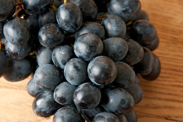 Grapes on a old wooden table