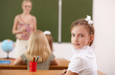 Little girl at school class