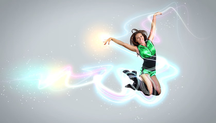 Fototapeta na wymiar Young woman dancer. With lights effect.