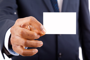 Close-up of business man handing a blank business card over whit