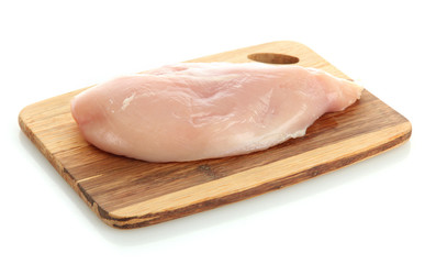 raw chicken meat on cutting board, isolated on white