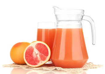 Full glass and jug of grapefruit juice and grapefruits isolated