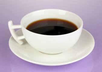 A cup of strong coffee on purple background