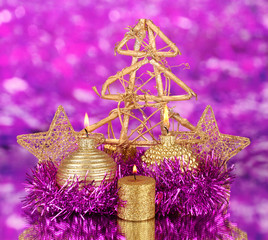 Christmas composition  with candles and decorations in purple