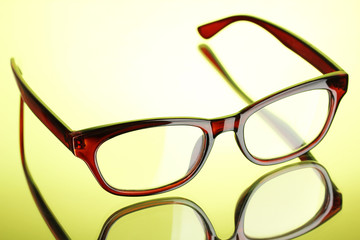 Beautiful glasses on green background