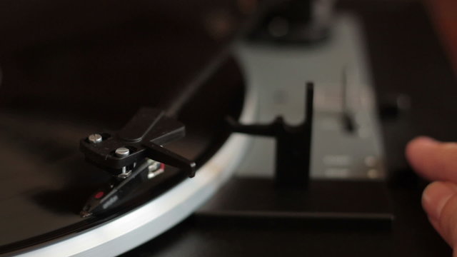 Pressing stop button of a turntable
