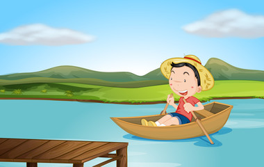 Un garçon ramant un bateau