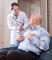 Fototapeta premium man tells the mature doctor the symptoms