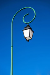 Fototapeta na wymiar Single tall street lamp. Old fashioned.