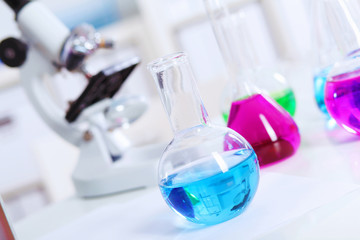 Chemistry laboratory glassware with colour liquids