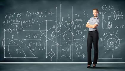 Business person against the blackboard