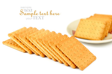 Heap of square crackers on a white background