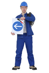 Electrician stood with coil and traffic sign