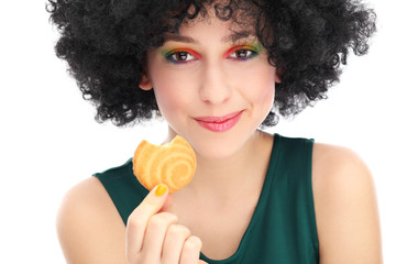 Funky woman eating cookie