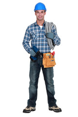 An electrician with a drill.