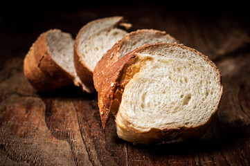 sliced wholemeal sesame bread on wood