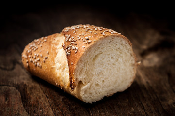 sliced wholemeal sesame bread on wood