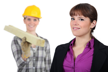 craftswoman and young businessman posing together