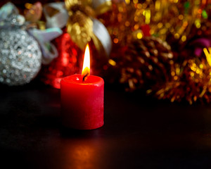 red candle with fire