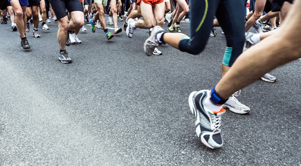 People running marathon on city street - 47901243
