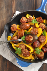 Fried Italian sausage with sweet peppers and onions