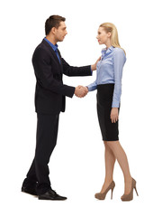 man and woman shaking their hands