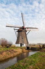 Historic windmill in a Dutch polder landscape