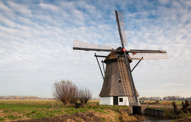 Historic windmill in a Dutch polder landscape