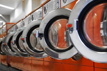 Row of washing machines in laundromat
