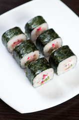 White plate with Dragon rolls, vertical shot