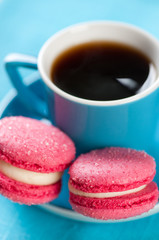 Espresso and macaroons, vertical shot, close-up