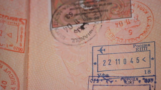 A passport with visas and stamps 
