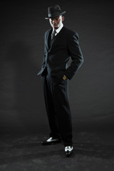 Black american mafia gangster man in suit.