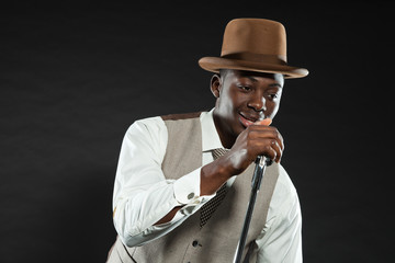 Black american jazz singer. Vintage. Studio shot.