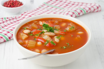bowl of roasted tomato soup with beans, celery and bell pepper