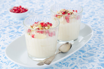semolina dessert with pomegranate seeds and pistachios