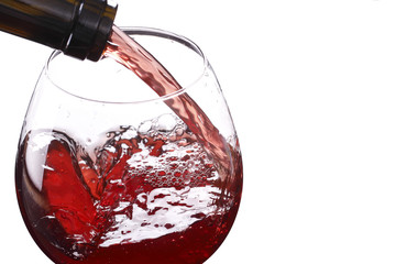 red wine pouring down from a wine bottle