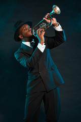 Black american jazz trumpet player. Vintage. Studio shot.