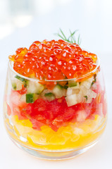 Red caviar salad in glass