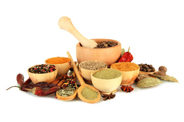 wooden mortar, bowls and spoons with spices isolated on white